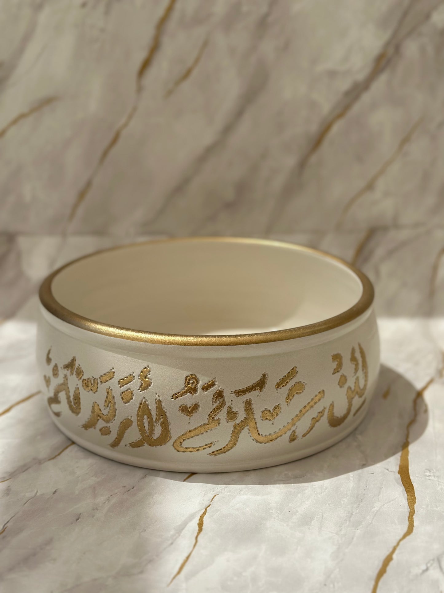 Discover the Handmade Ceramic Deep Plate adorned with intricate gold calligraphy, a masterpiece crafted by skilled artisans. Available in a variety of elegant designs, including gold and white marbling, this plate is perfect for serving your favorite meals with style and sophistication.