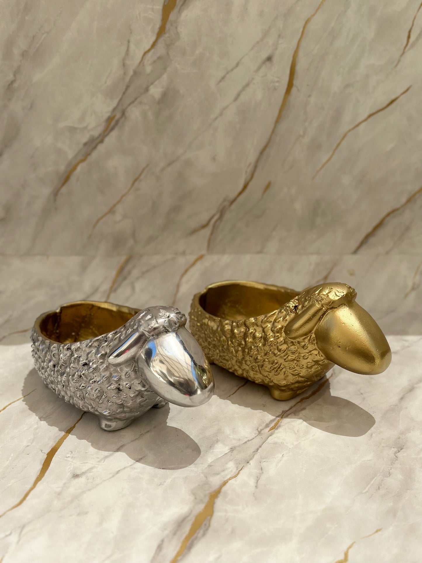 ChatGPT Elevate your Eid al-Adha celebrations with our exquisite Sheep Chocolate Holders, crafted from metal with intricate detailing that captures the joyous essence of the occasion. Available in radiant gold or sleek silver finishes, these holders are perfect for presenting chocolates or small treats, ensuring your festivities shine with tradition and sweetness.