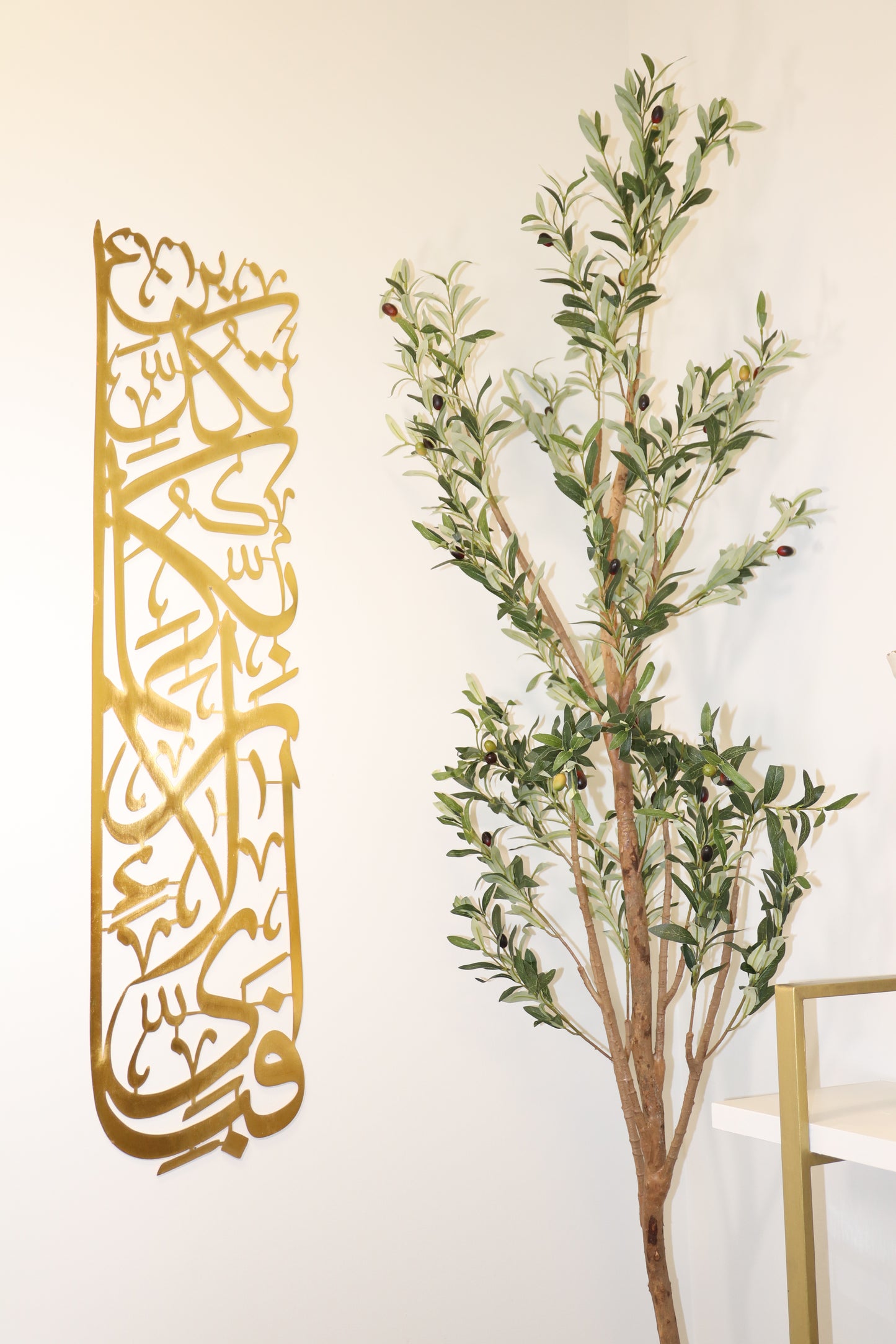 ChatGPT Elevate your decor with the "Majestic Script Wall Adornment," featuring Arabic calligraphy in a rich gold finish. Crafted from durable metal, it adds cultural sophistication and a serene ambiance to any room. Easy to install, this impactful piece blends modern style with timeless craftsmanship for a stunning focal point in your home.