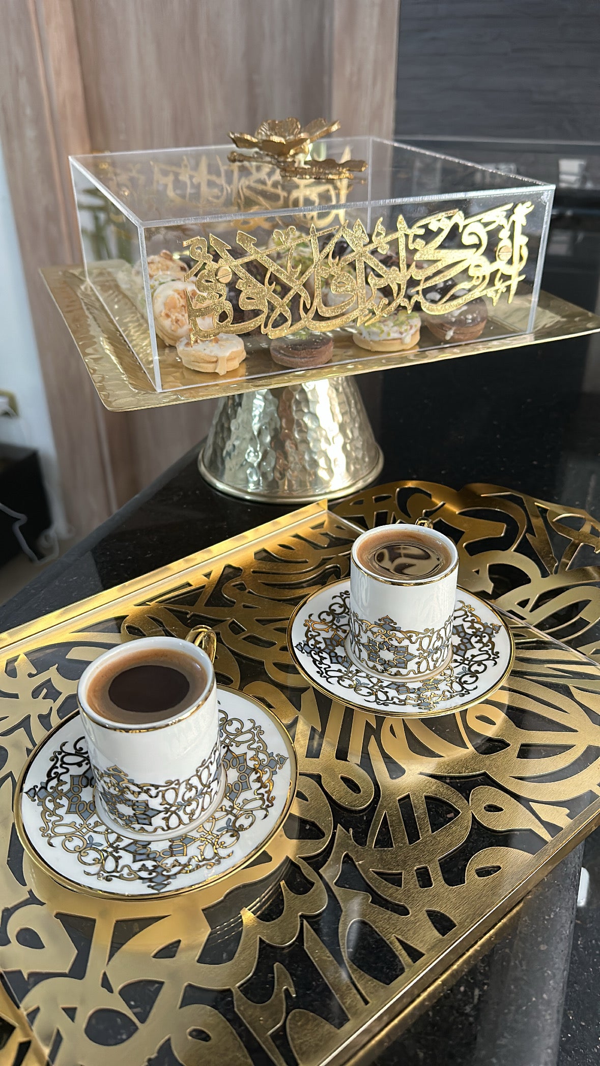 "Transform your space with the Andalusia Decorative Tray, meticulously crafted from aluminum and acrylic, showcasing intricate Arabic calligraphy in a luxurious gold tone. This large tray combines functionality with artistic elegance, ideal for enhancing any room."