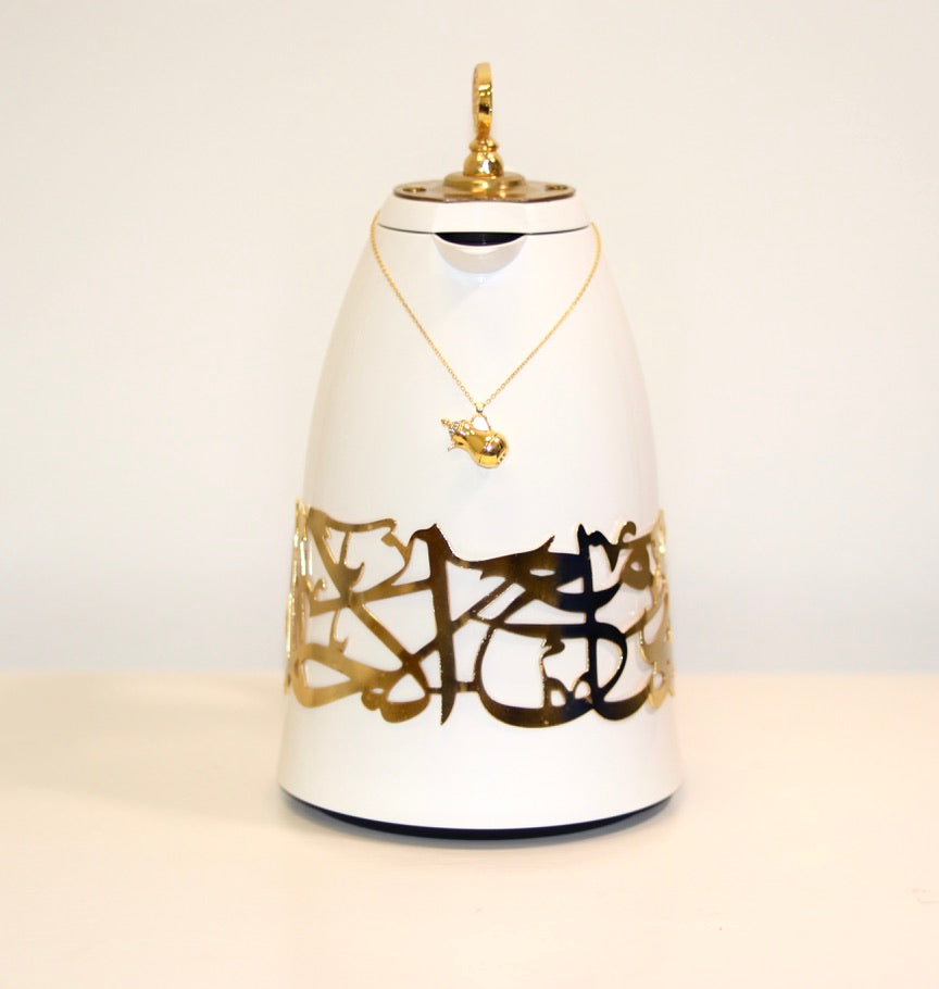 Elevate your coffee ritual with the Arabesque Elegance Charm set, designed to add opulent tradition to your hosting. Crafted from high-quality metal, featuring delicate Arabic calligraphy, it's perfect for labeling flasks with cultural beauty and luxury. A versatile addition for both special occasions and everyday use, ideal for coffee enthusiasts who appreciate heritage-inspired decor.