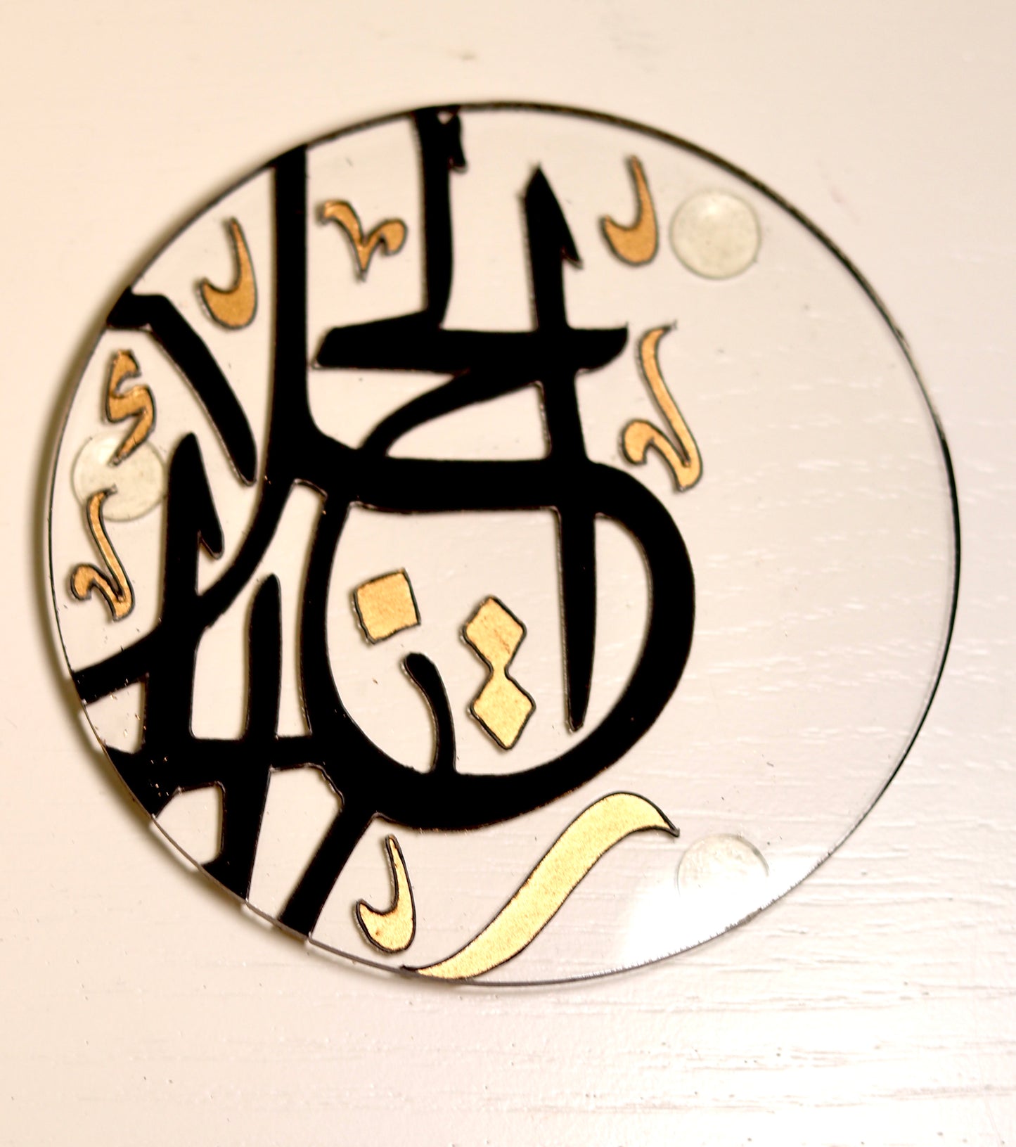 Introducing our "Calligraphic Elegance Acrylic Coasters," adorned with striking Arabic calligraphy in elegant black and gold tones. Made from high-quality acrylic, these coasters offer both durability and a clear, sophisticated look. Ideal for enhancing your table setting with a touch of cultural refinement.