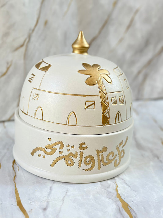 Elevate your Eid celebrations with our Handmade Ceramic Eid Chocolate Bowl, intricately adorned with traditional gold calligraphy and geometric patterns. Perfect for serving chocolates or as a stunning centerpiece, it captures the essence of Eid in every detail.