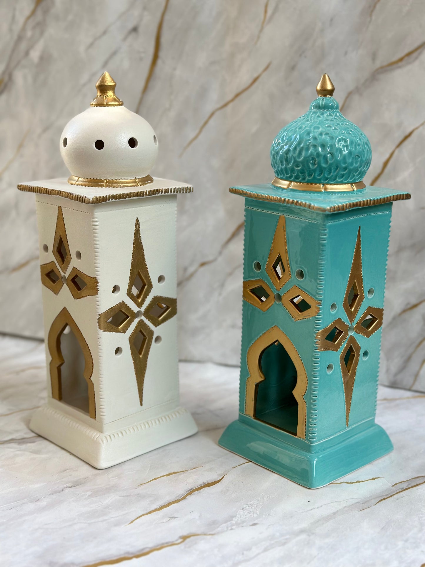 Celebrate Ramadan with our Ceramic Minaret, available in cream and turquoise shades enhanced by shimmering gold details. Its minaret-inspired silhouette not only diffuses incense delicately but also serves as a captivating centerpiece for your decor.