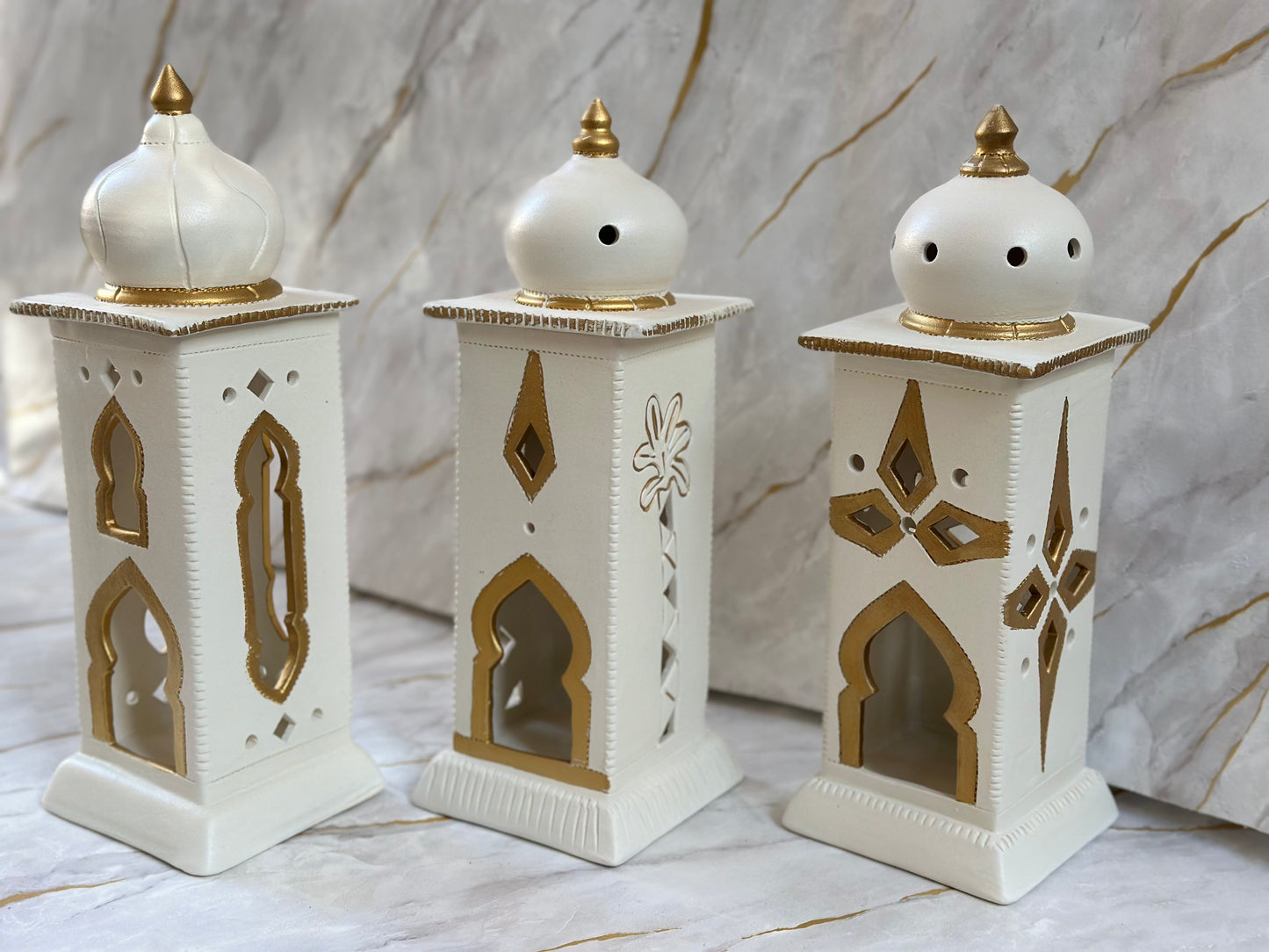 Create a serene Ramadan setting with our Ceramic Minaret, available in cream and turquoise with lavish golden touches. Its elegant design, perfect for electric candles or incense, enhances both spiritual focus and aesthetic appeal.