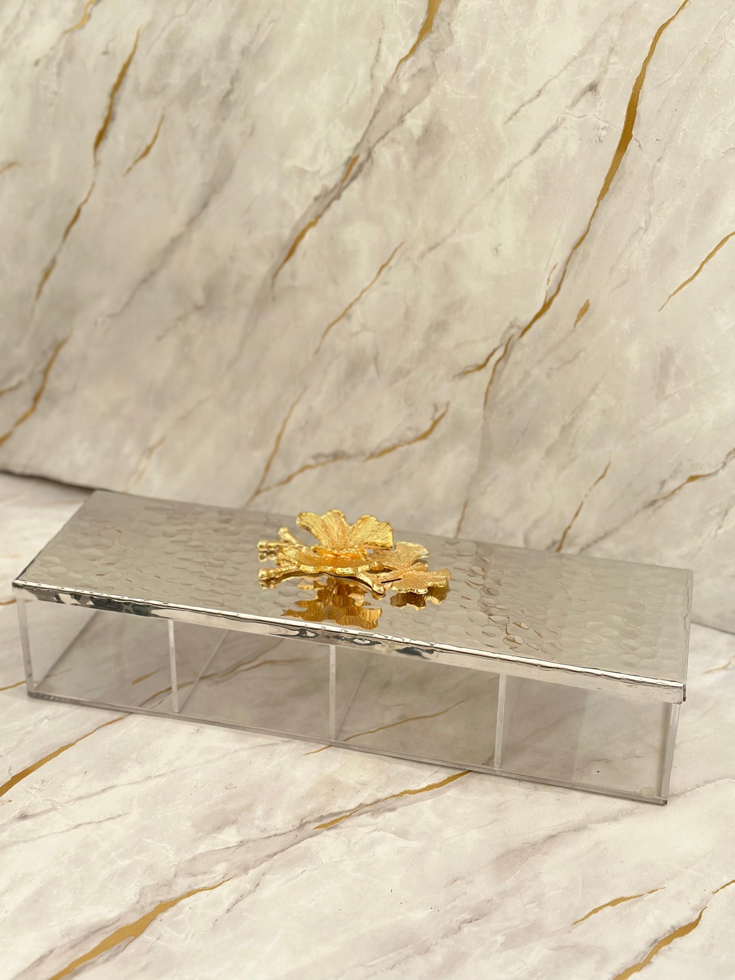 Introducing our Divided Arabesque Metal Tray, a blend of elegance and functionality. Its mirrored sections and golden floral ornamentation offer both beauty and utility, while clear acrylic legs provide a contemporary touch. Perfect for serving chocolates and nuts with finesse.