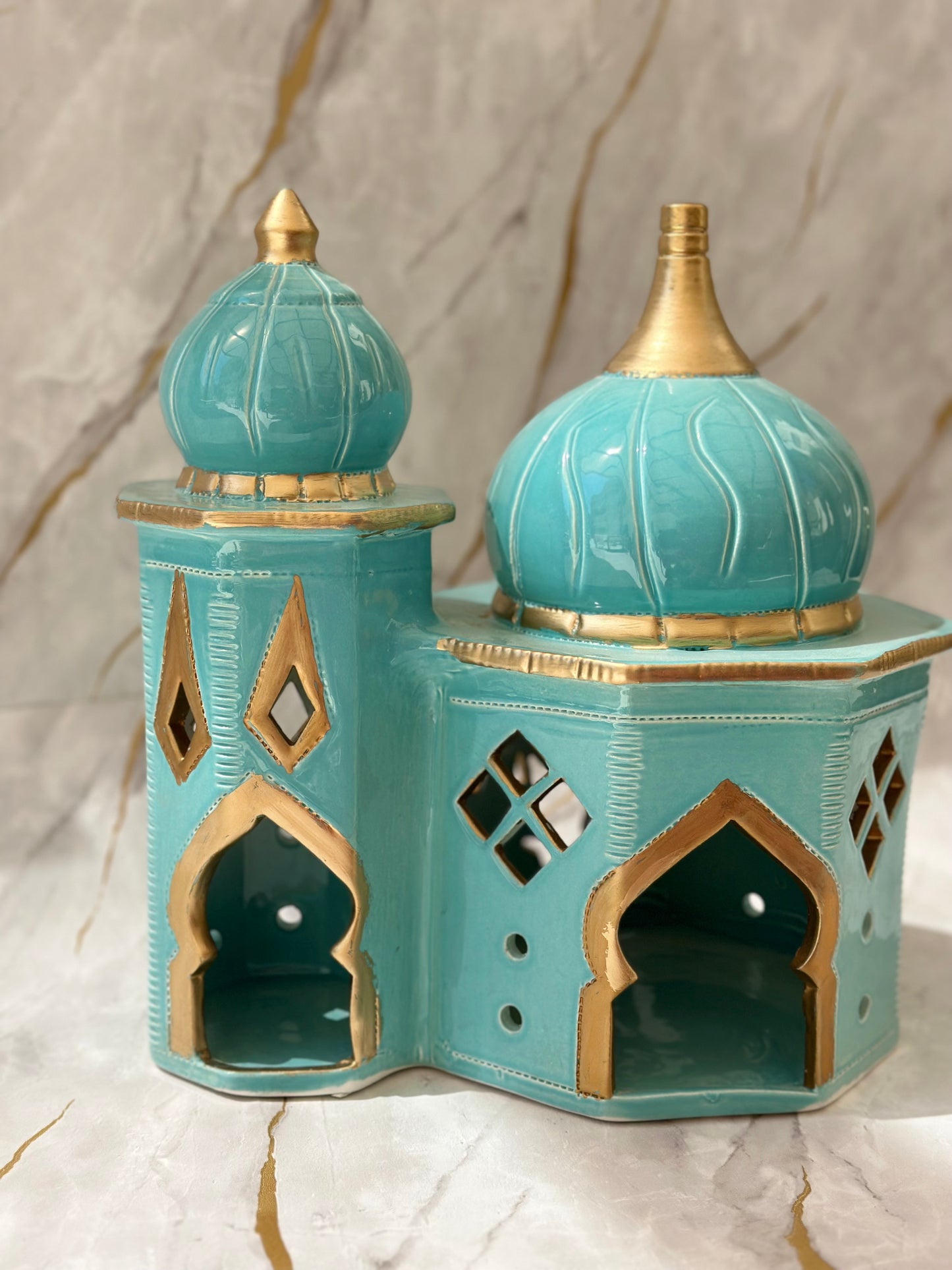 Elevate your Ramadan decor with our Handcrafted Ceramic Double Mosque, meticulously designed to radiate spirituality and elegance. Handcrafted by skilled artisans, this piece symbolizes unity and tranquility, making it a perfect addition to your home during this sacred season.