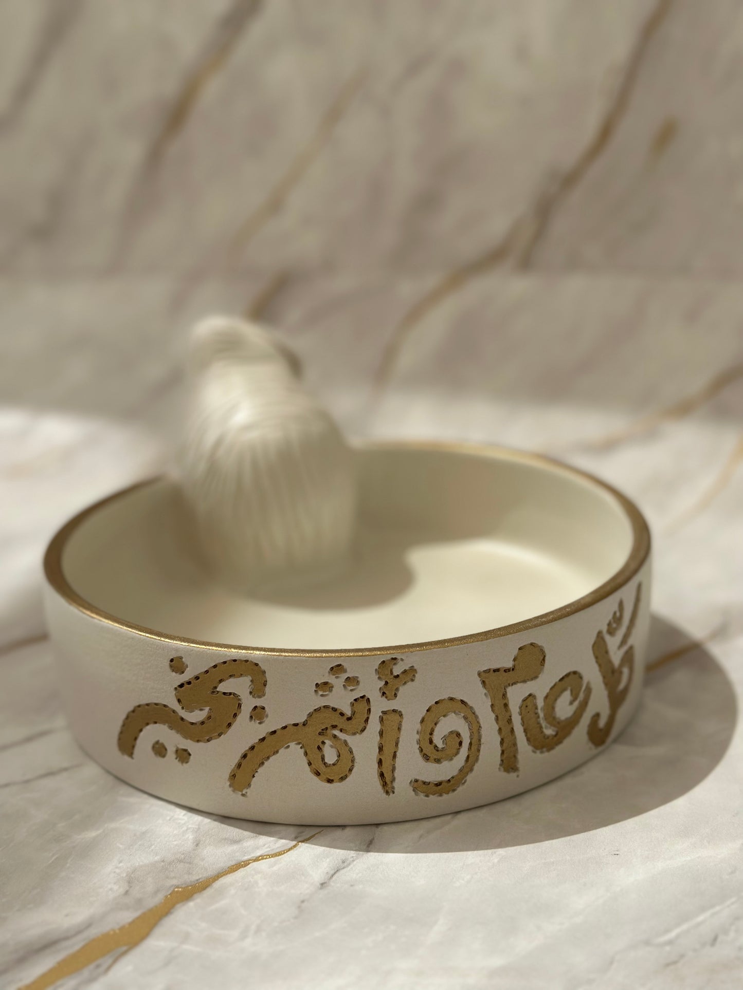 Enhance your space with our Ceramic Sheep Bowl, blending whimsy and elegance in one. Crafted with artisanal precision, it features a soft cream glaze with a hint of gold, perfect for serving or storing small items. Ideal as both a decorative accent and a thoughtful gift.