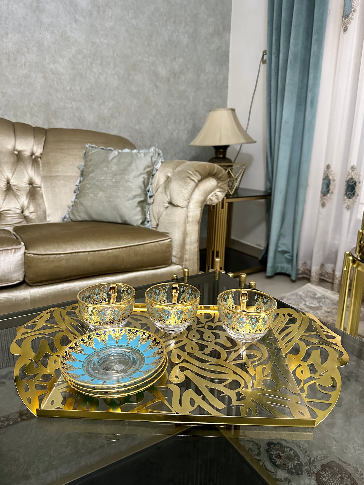 "Discover the beauty of the Andalusia Arabic Calligraphy Tray, crafted from aluminum and acrylic to showcase intricate designs and a golden finish. Perfect for enhancing your home decor, this decorative tray blends artistic flair with modern materials."