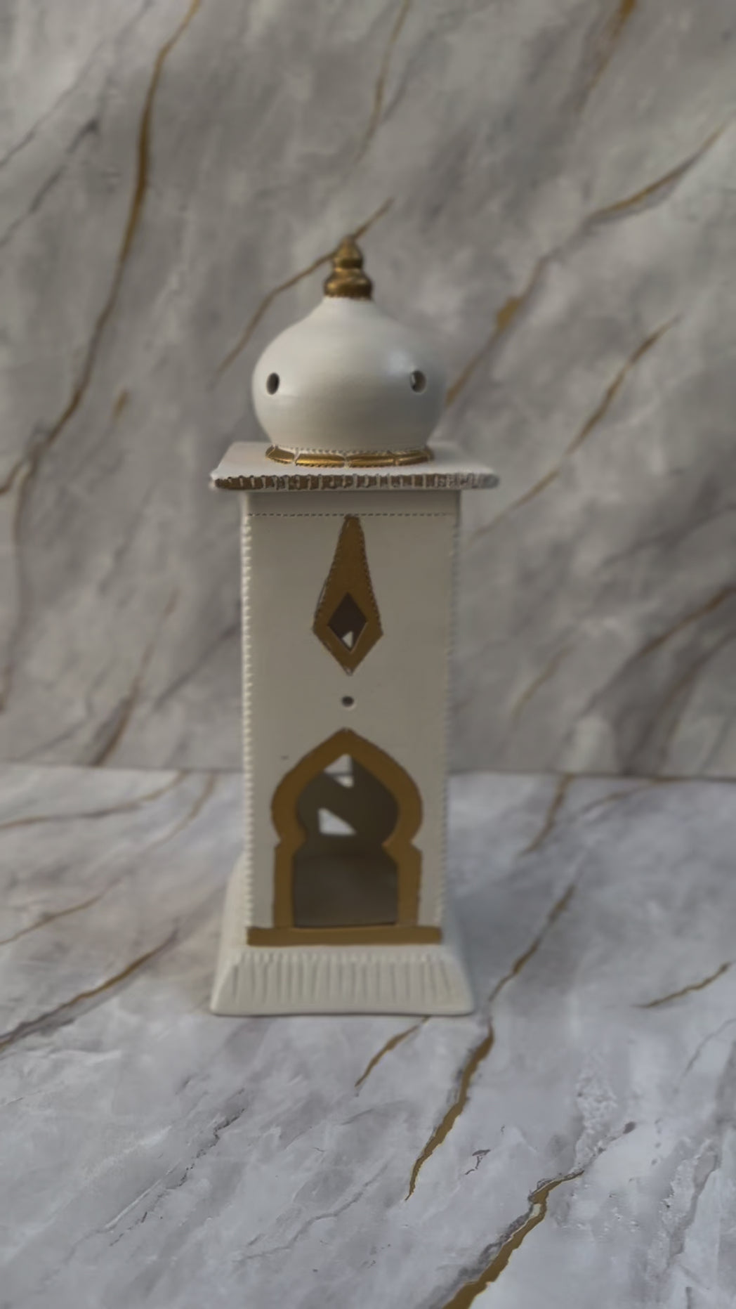 Illuminate your Ramadan nights with our Ceramic Minaret, available in cream and turquoise with intricate golden details. Crafted to mirror Islamic architecture, it creates a serene ambiance ideal for prayer and reflection.