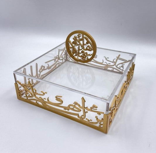 Robust, durable, and safe: This acrylic decor box is hand-made with premium acrylic, featuring gold Arabic Calligraphy that says 'نزلتم سهلا وحللتم اهلا.' More solid than glass, it is easy to clean with polished edges for safety. The elegant and modern design of this acrylic tray with gold handles adds style to any decor. Perfect for home decor in a box, as a decorative box set, or napkin holder. Dimensions: Length 8.75in, Width 4.75in, Height 3in